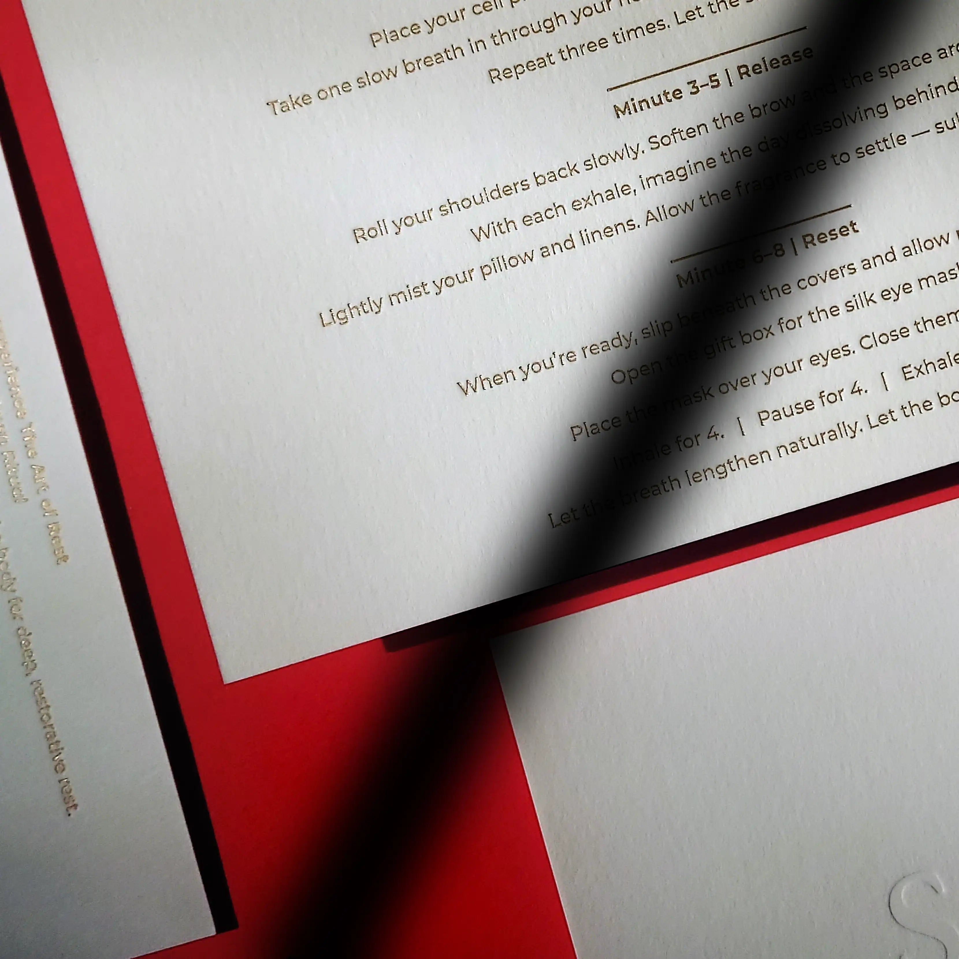 Textured cotton 45pt debossed postcard featuring matte gold foil details, premium tactile print produced by OddPlanPrint.