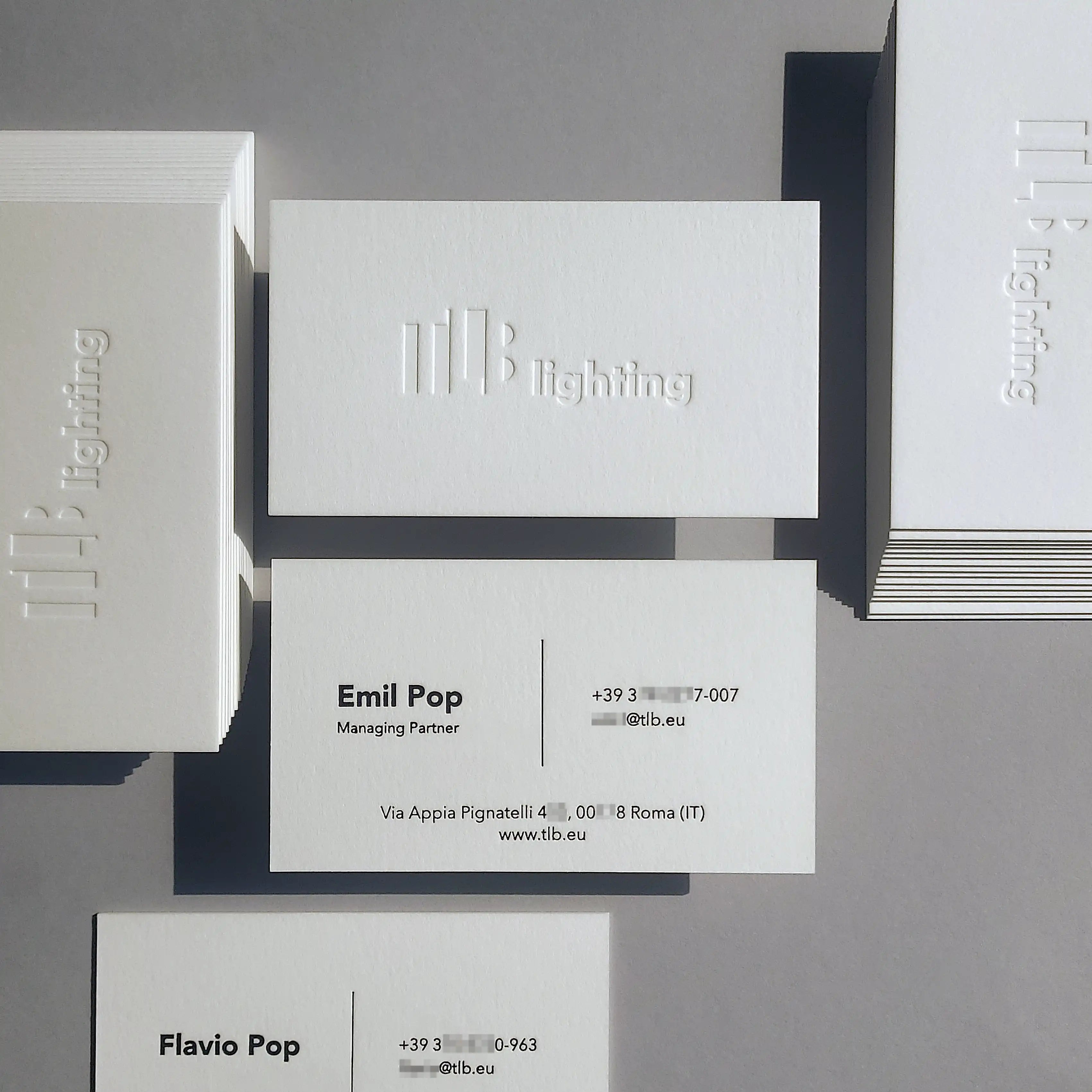 Elegant 45pt cotton debossed business card by OddPlanPrint, with glossy black foil.