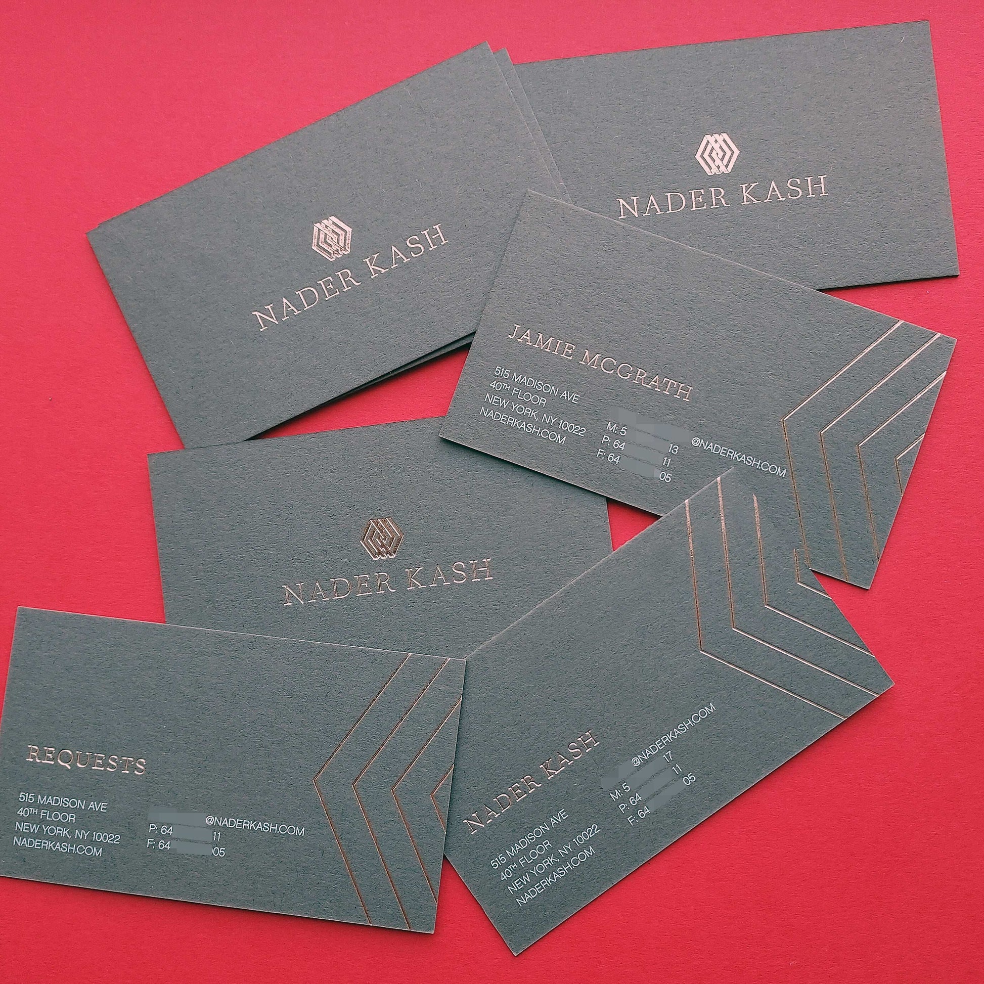 Custom-printed dark grey business card with foil and express delivery.