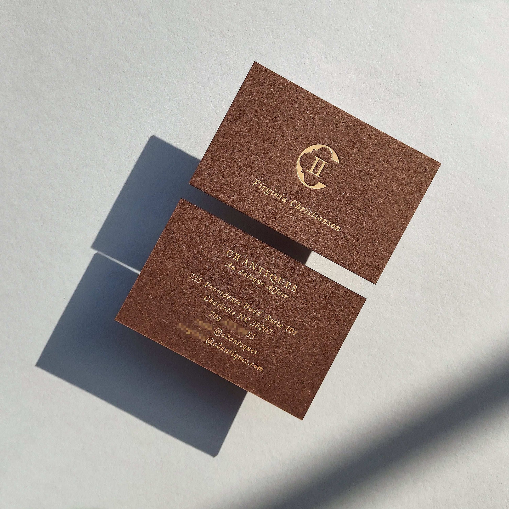 Tailor-made brown card with foil for modern business owners.