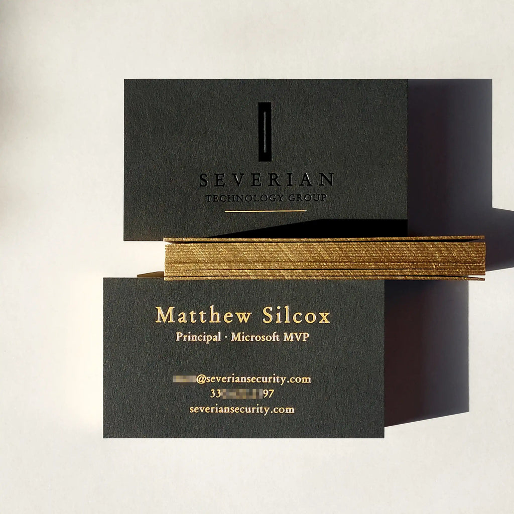 38pt thick black business cards with gold painted edge and black foil and deboss and gold foil by OddPlanPrint.
