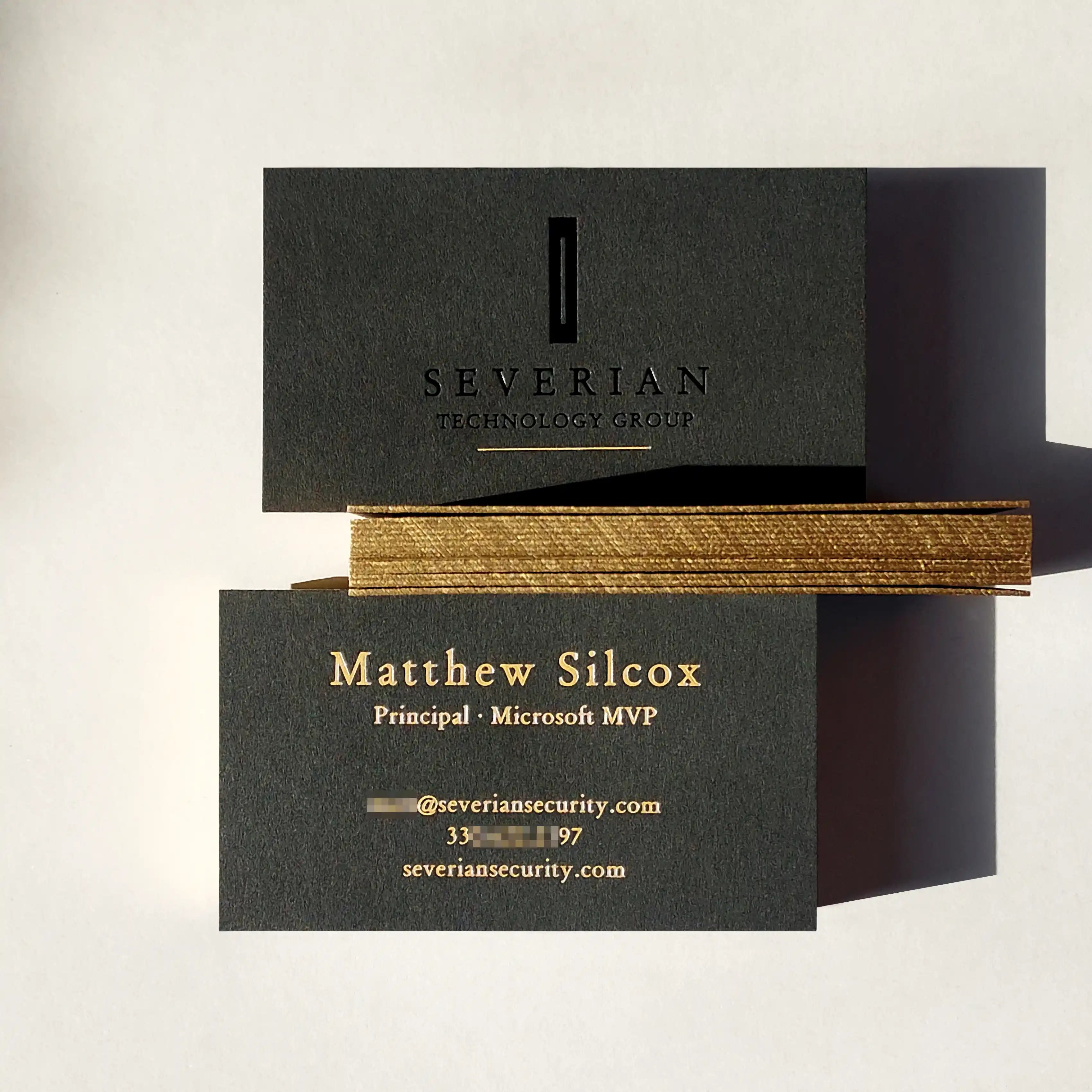 38pt thick black business cards with gold painted edge and black foil and deboss and gold foil by OddPlanPrint.