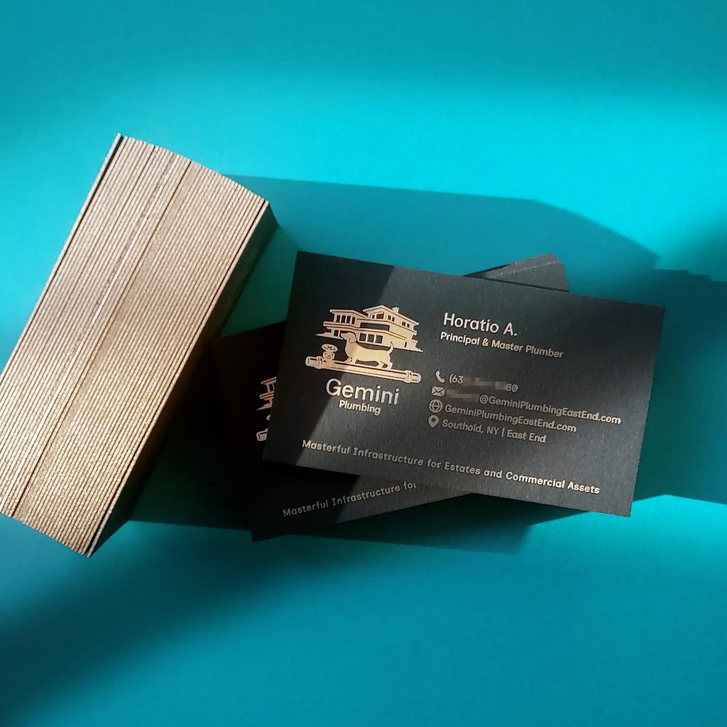 Premium black business cards with gold painted edges, matte foil text and logo by OddPlanPrint