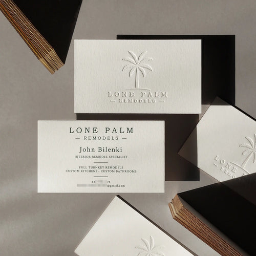Gold painted edge cotton business cards 45pt with deboss and dark green pantone printing by OddPlanPrint.