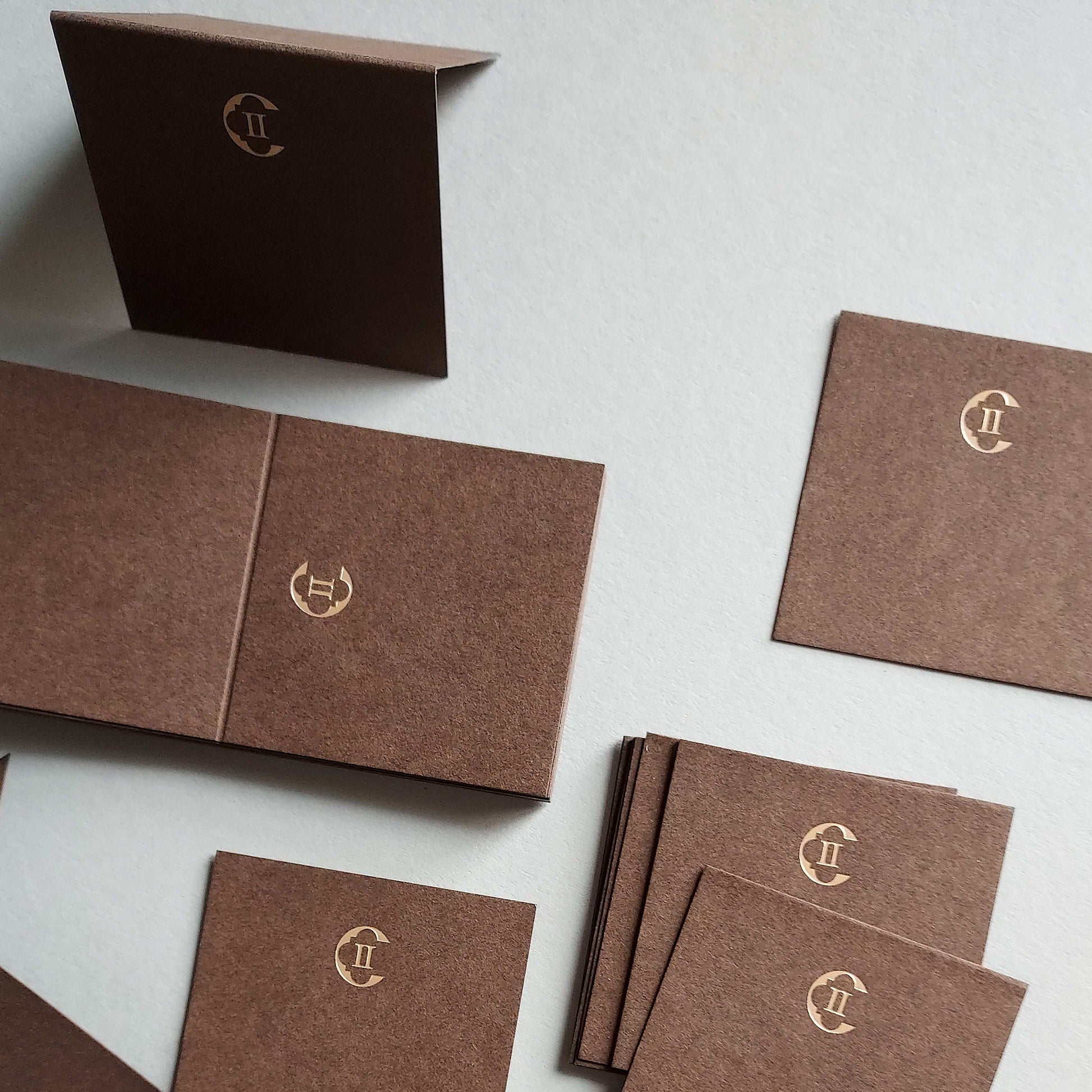 Personalized brown card with foil, deboss, and premium finish for artists.