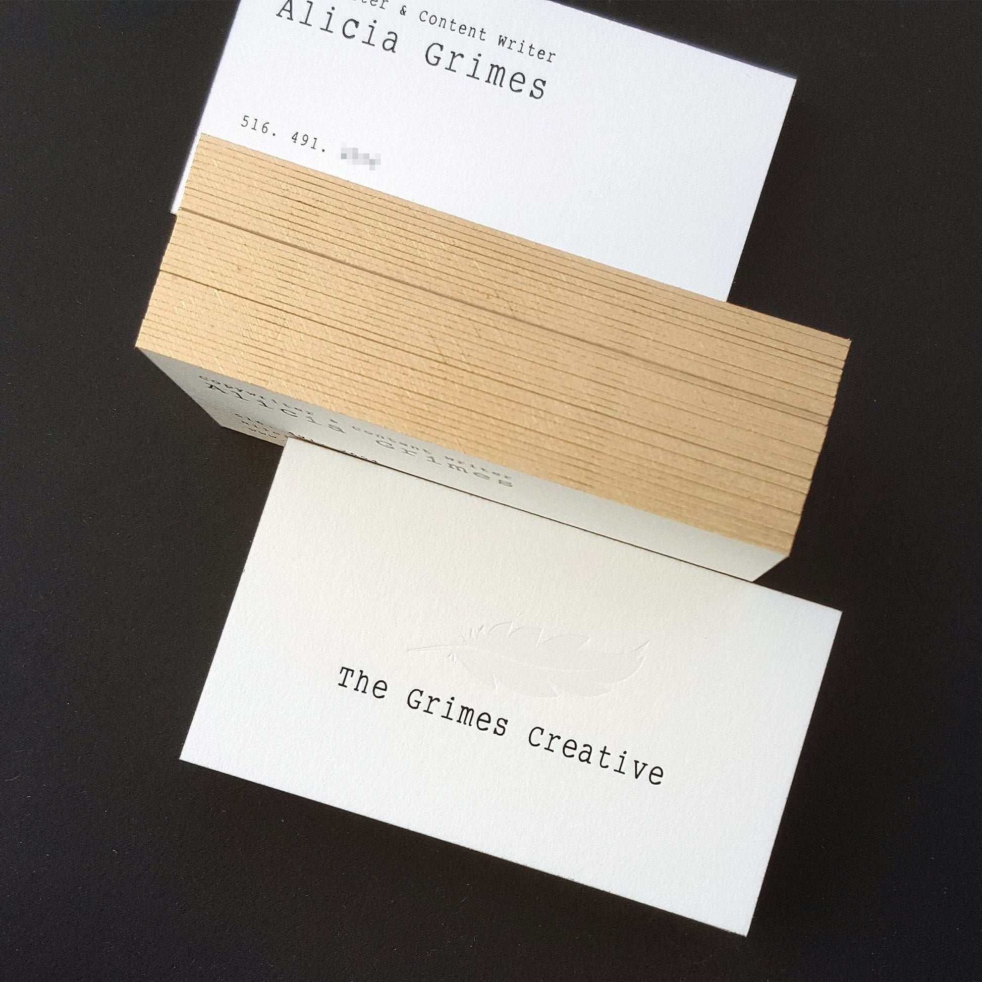 Custom-designed cotton paper card with hand-painted gold edges.