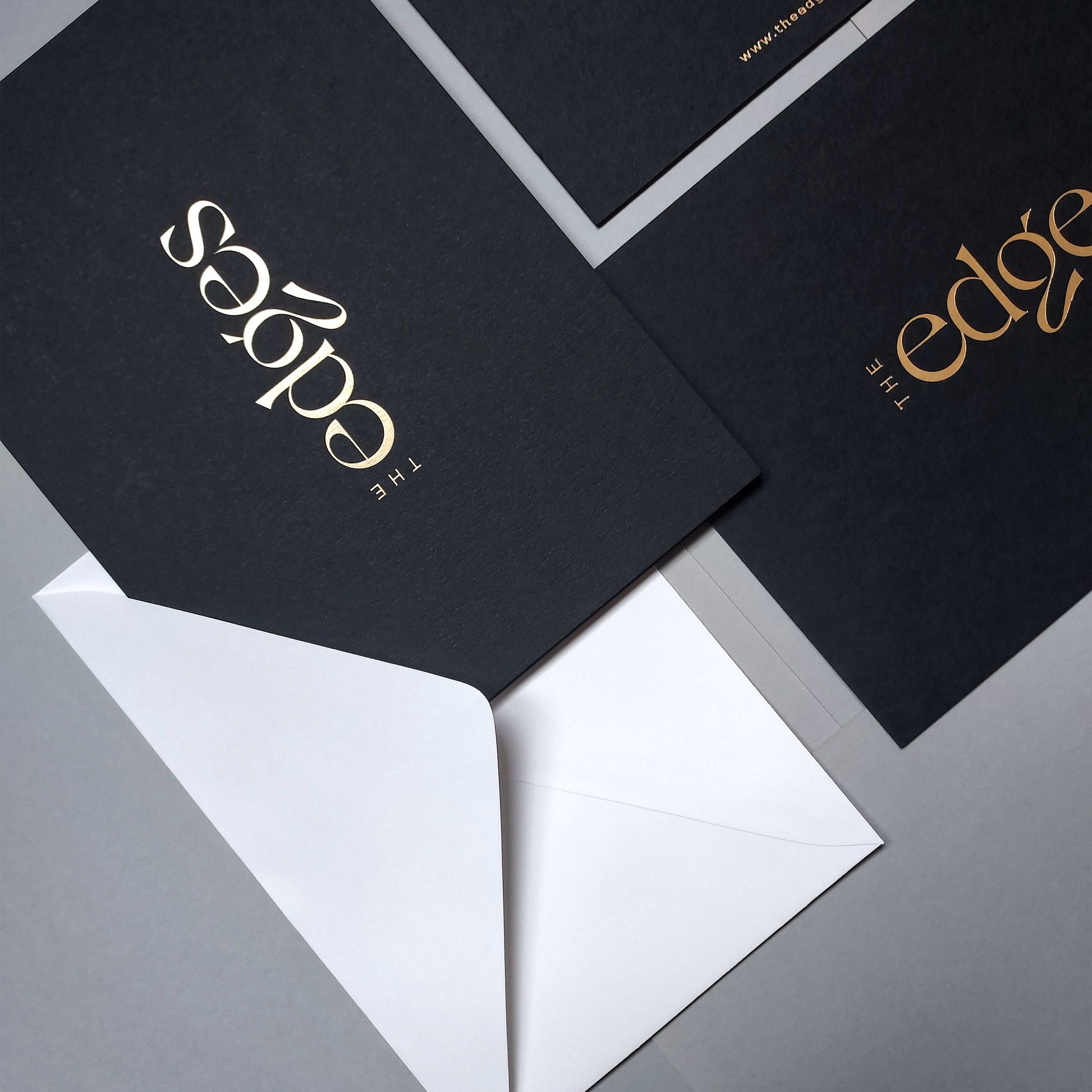 Elegant black 4x6 postcards with foil and white envelope
