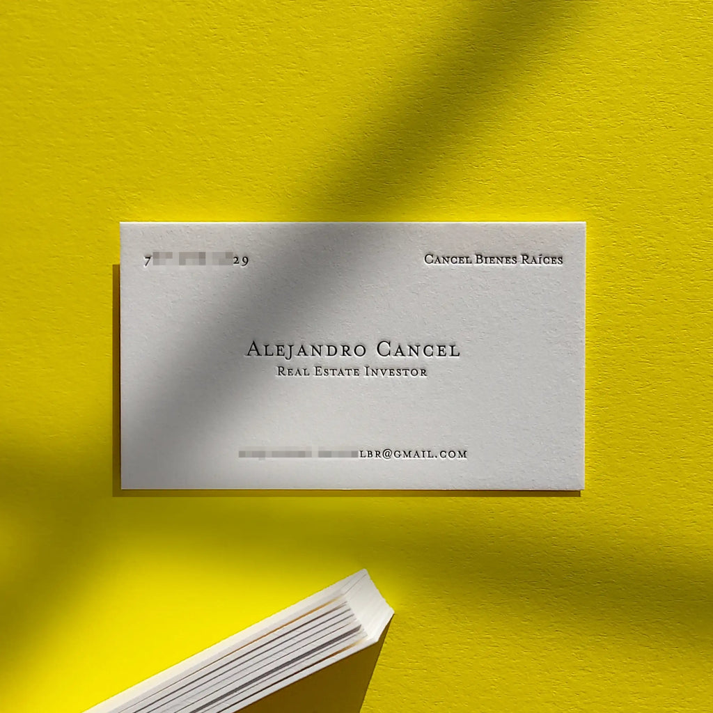 High-contrast 45pt cotton letterpress business cards featuring black printing and inkless blind deboss produced at OddPlanPrint.