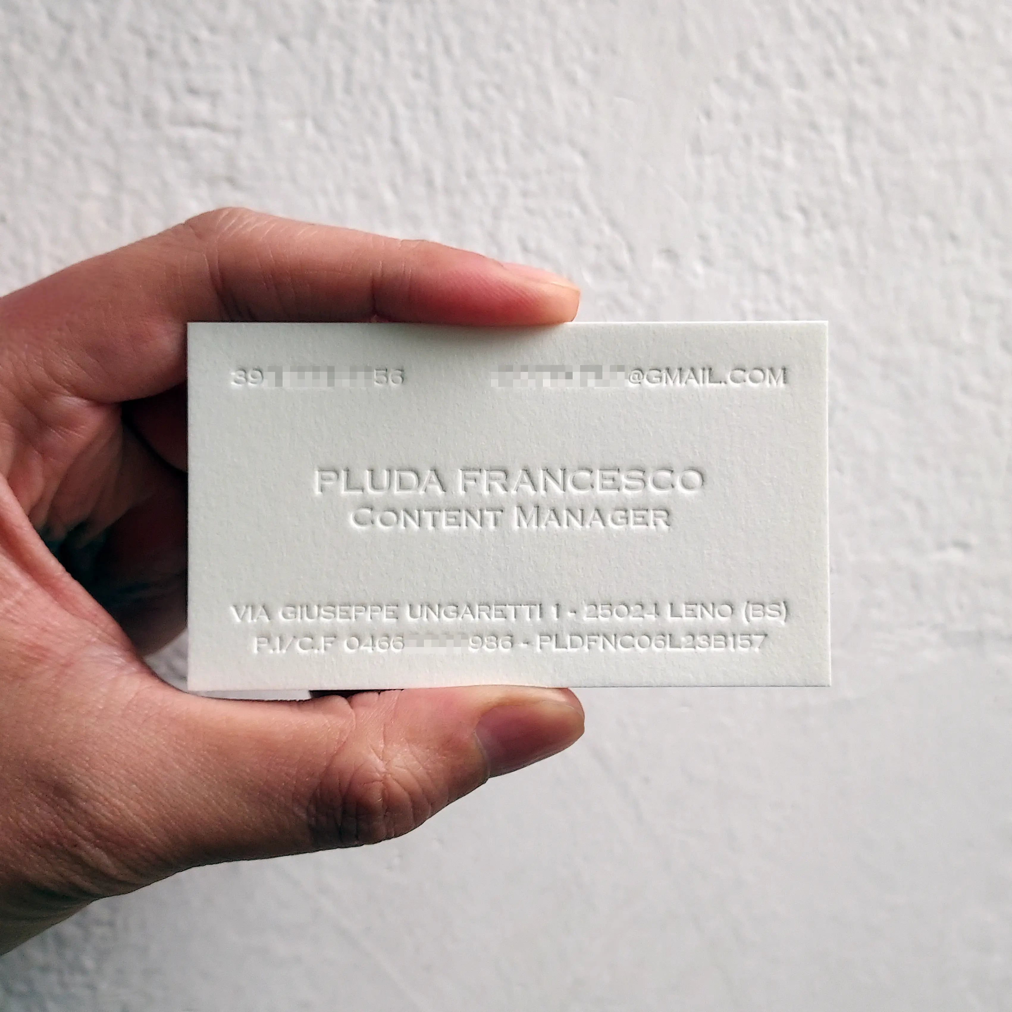 Signature single-sided blind letterpress business card by OddPlanPrint, emphasizing the unique texture and quality.