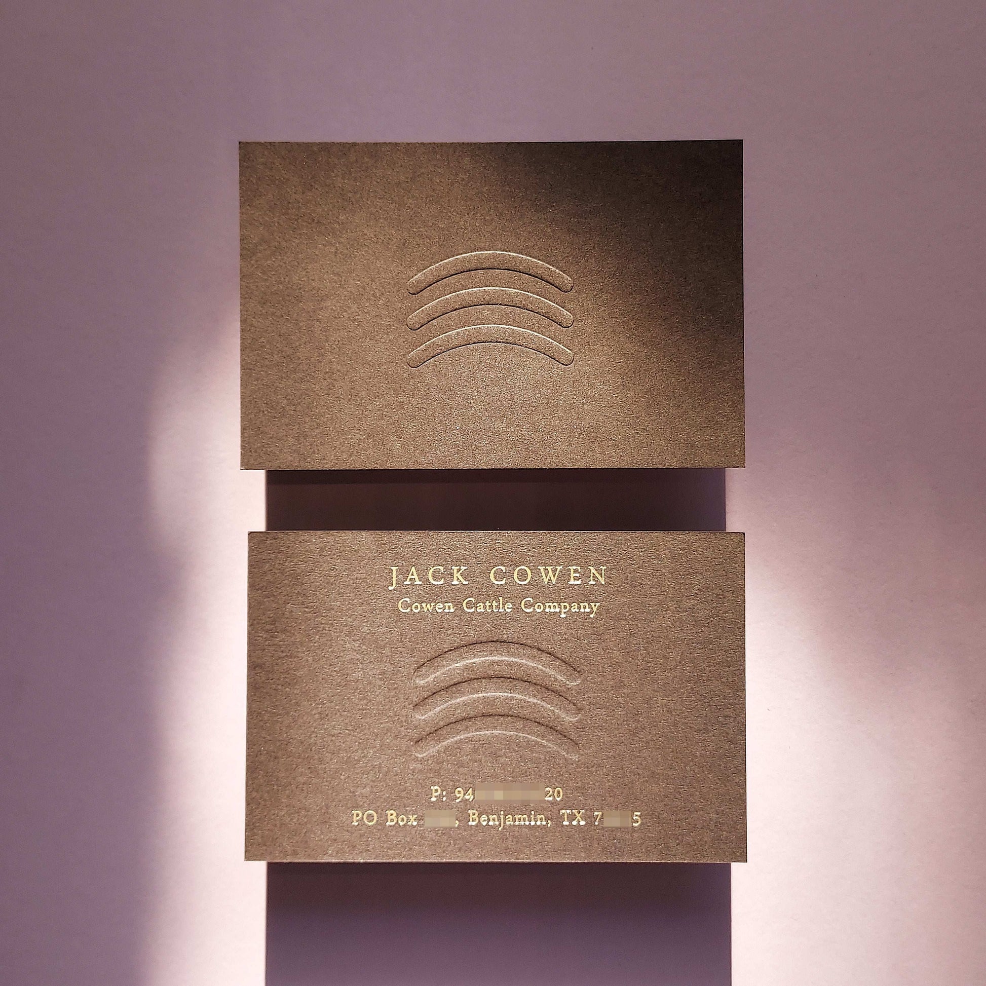 Elegant brown business card with custom emboss and fast shipping for creatives.