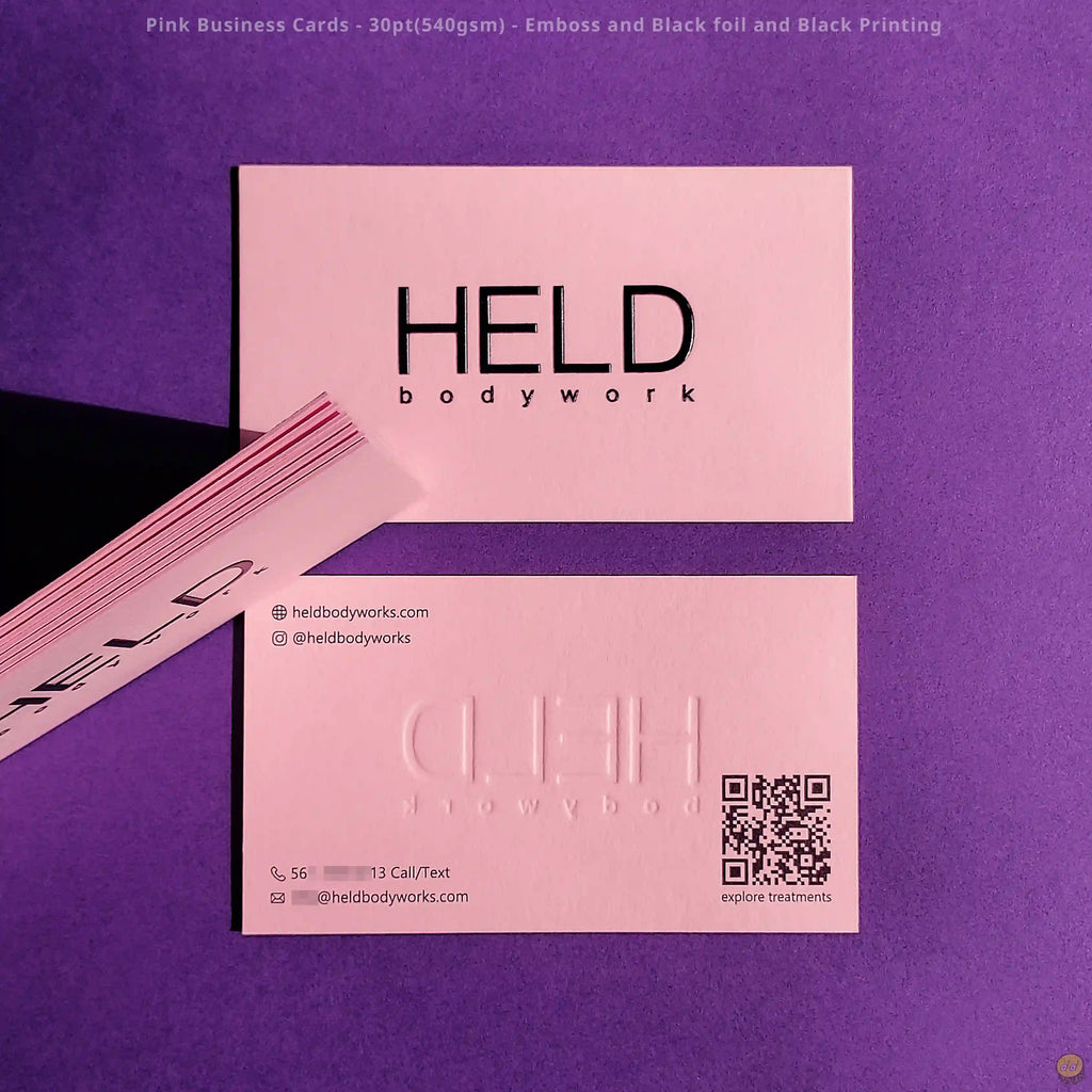 Pink business cards use raised emboss, black foil, and clear black printing by OddPlanPrint.
