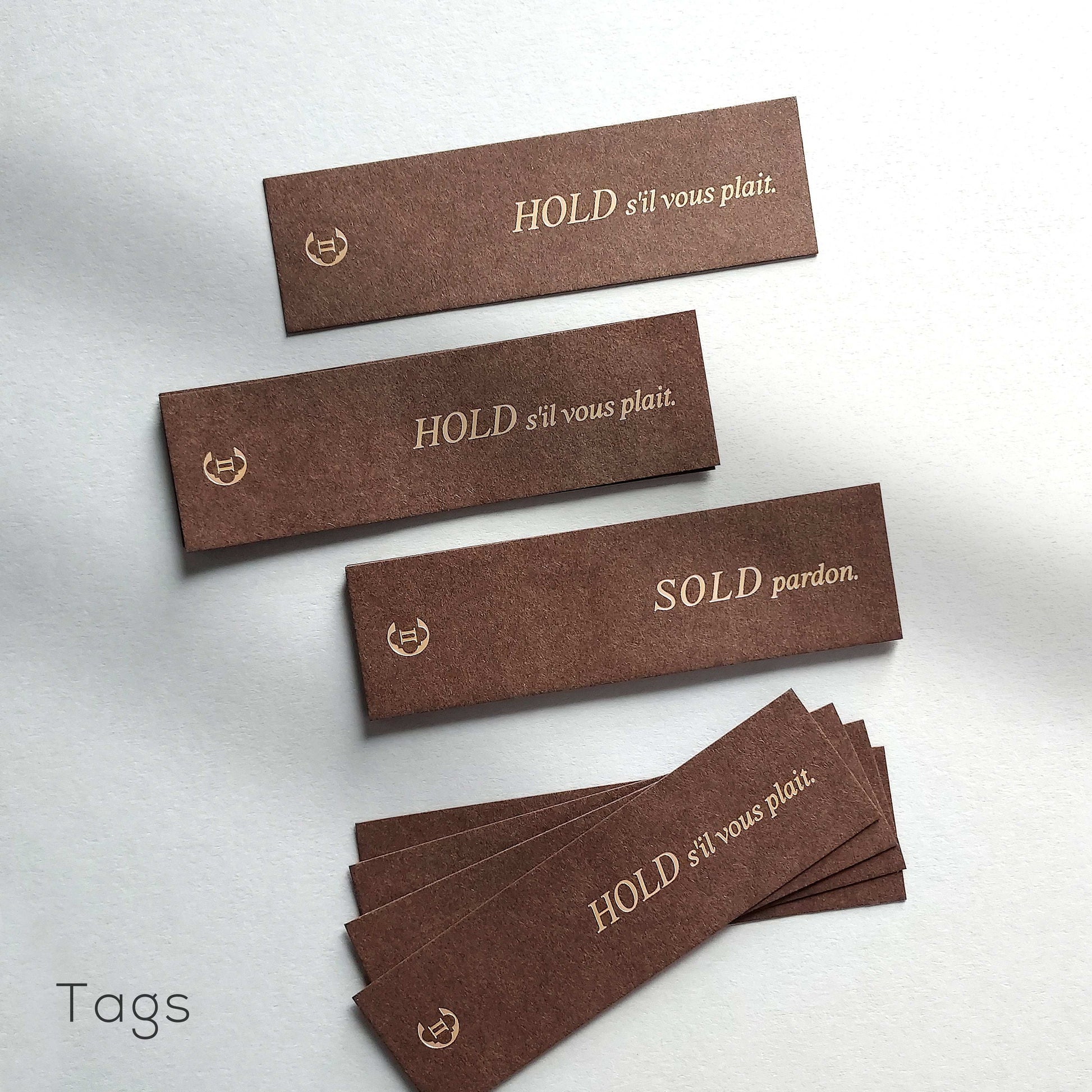 Stylish brown business card with blind deboss and foil for young entrepreneurs.
