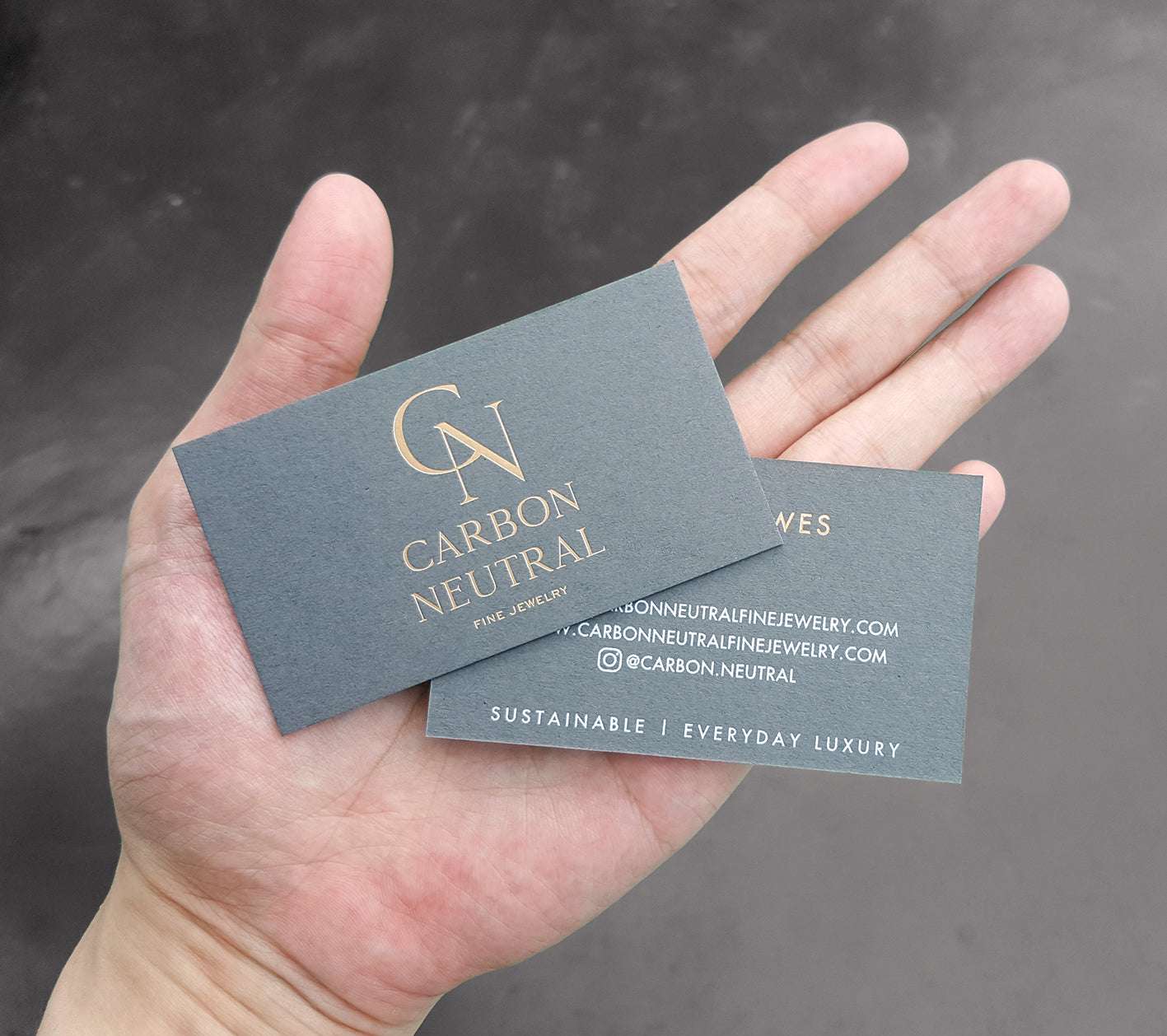 Elegant dark grey card with letterpress and deep texture for boutique firms.