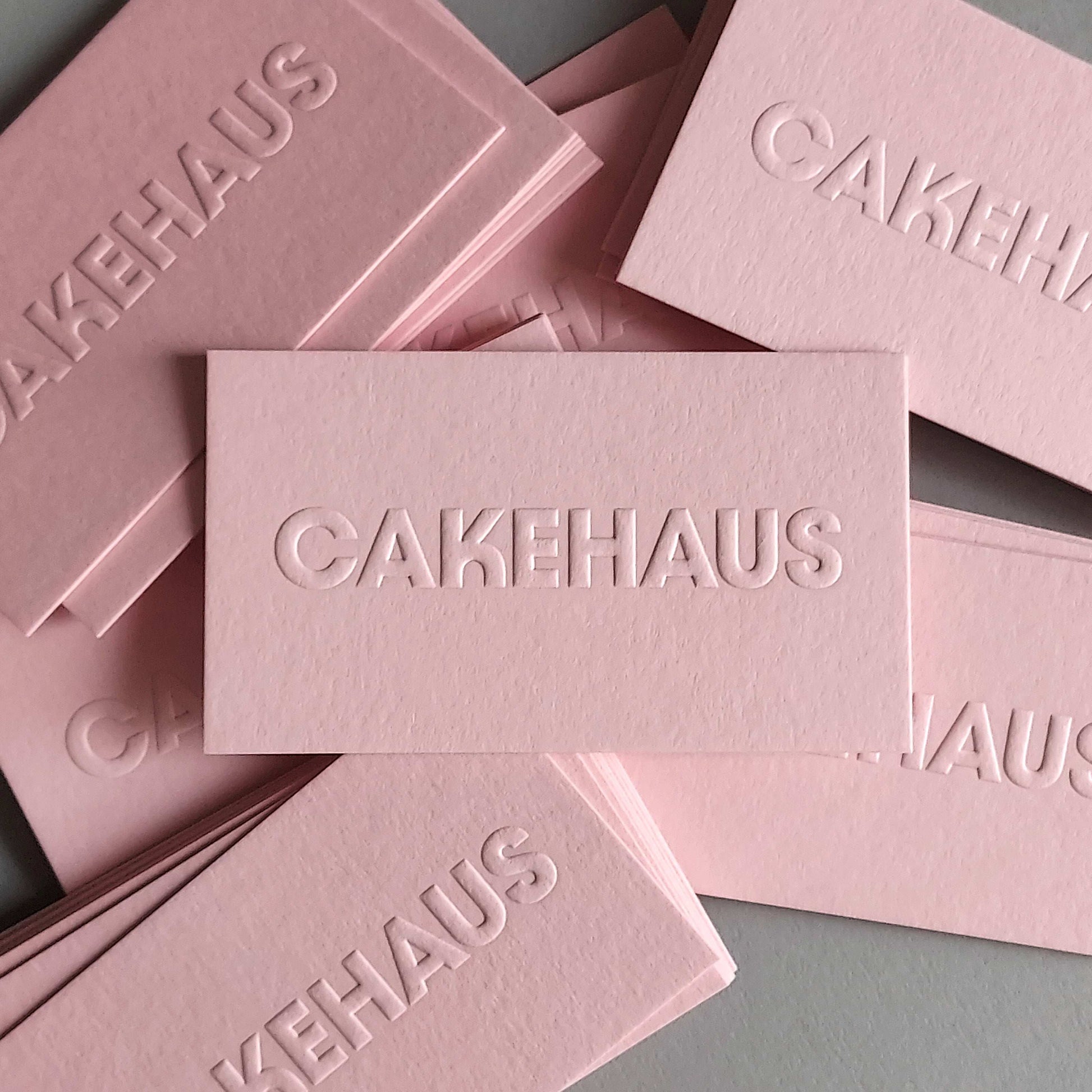 Custom-designed pink card with blind emboss and fast shipping.