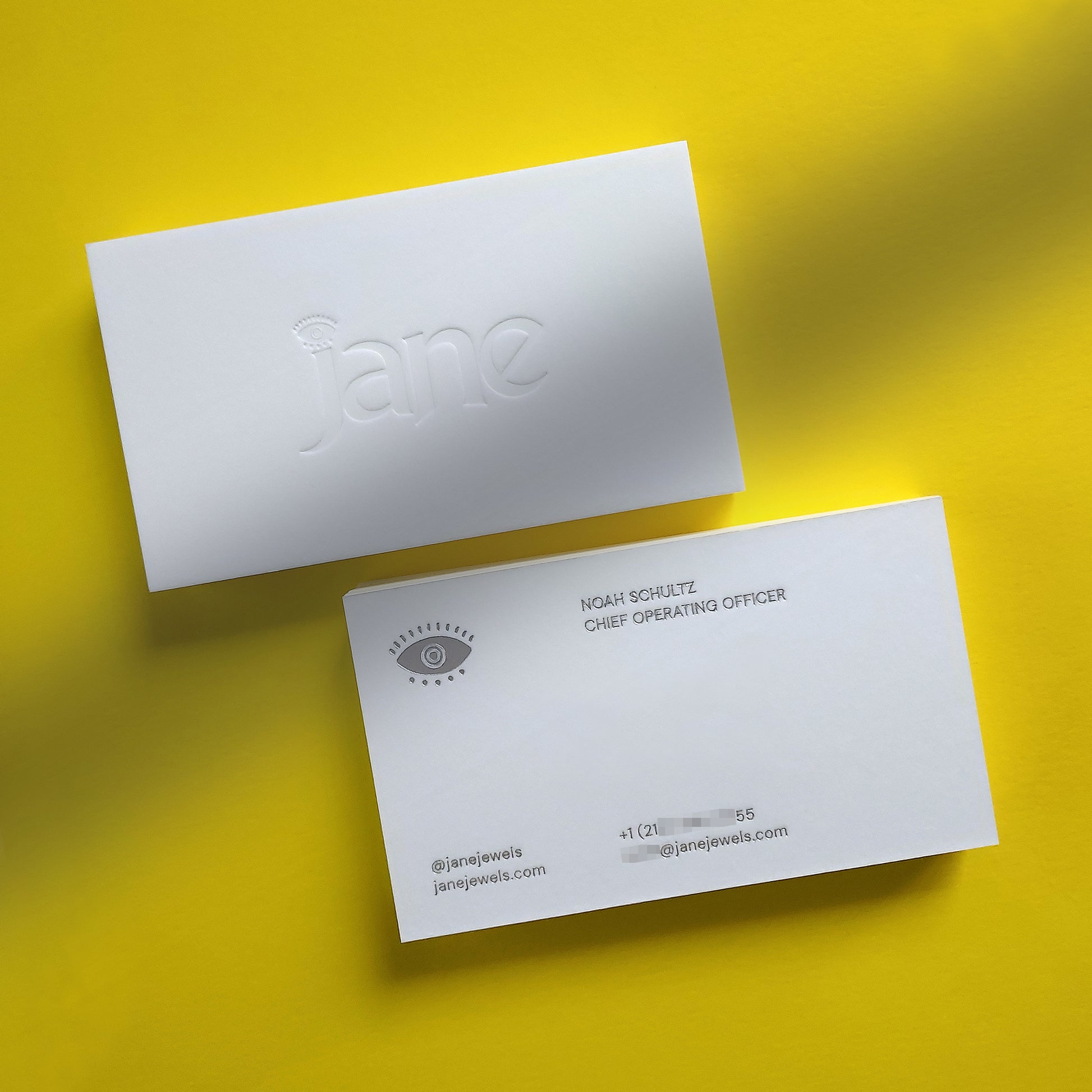 Refined cotton card with debossed monogram