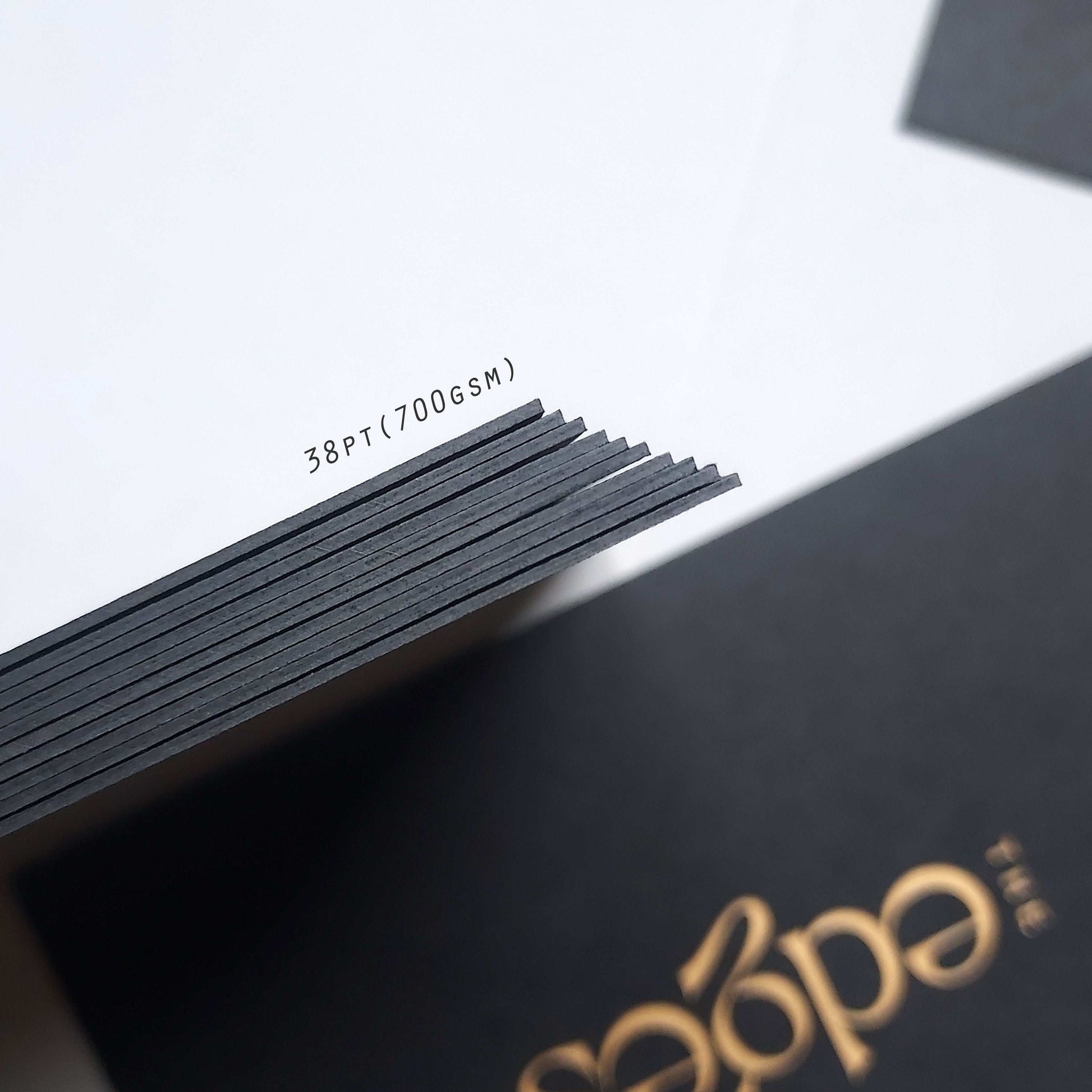 Luxury black stationery card featuring foil and deboss design.