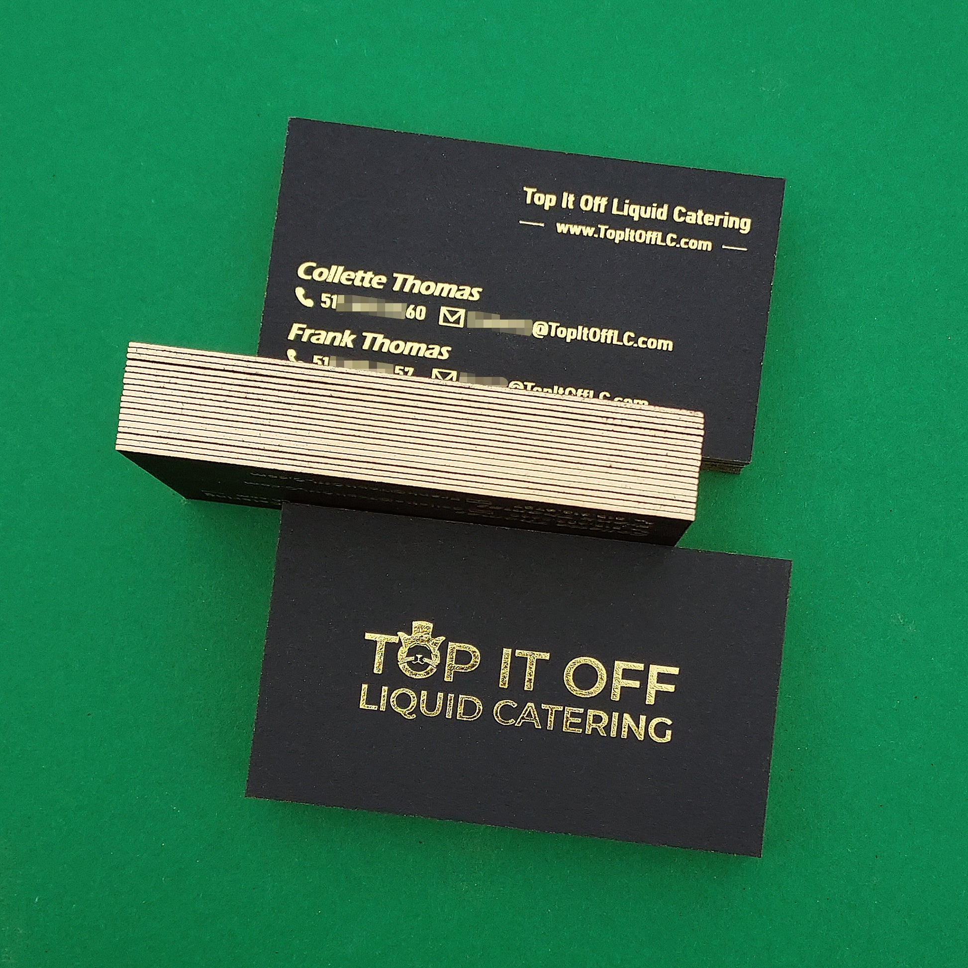 Custom black card with letterpress branding and foil logo