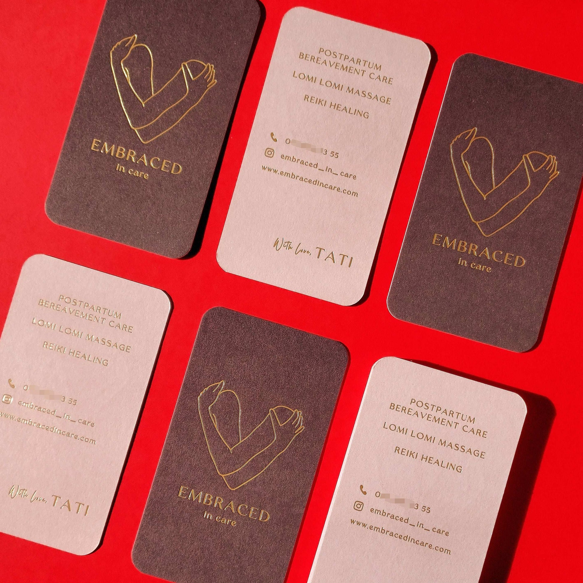 Elegant business card with double-sided printing and foil highlights.