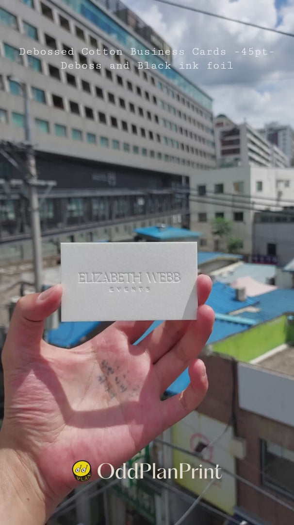 Luxury debossed 45pt cotton business cards with black ink foil from OddPlanPrint.