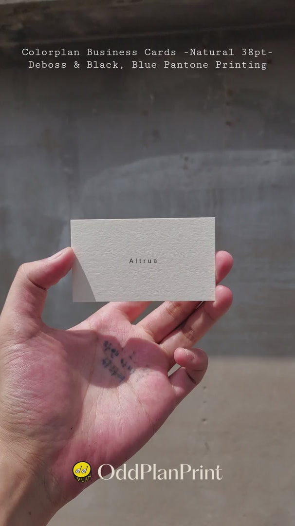 Off-white 38pt Colorplan business cards featuring crisp debossed details and dual-color Pantone printing created by OddPlanPrint.