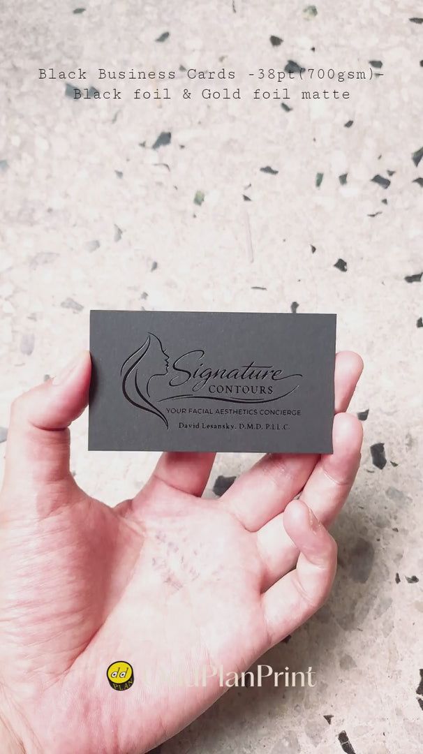 Heavy 38pt,700gsm black business cards finished with glossy black foil and matte gold foil by OddPlanPrint.