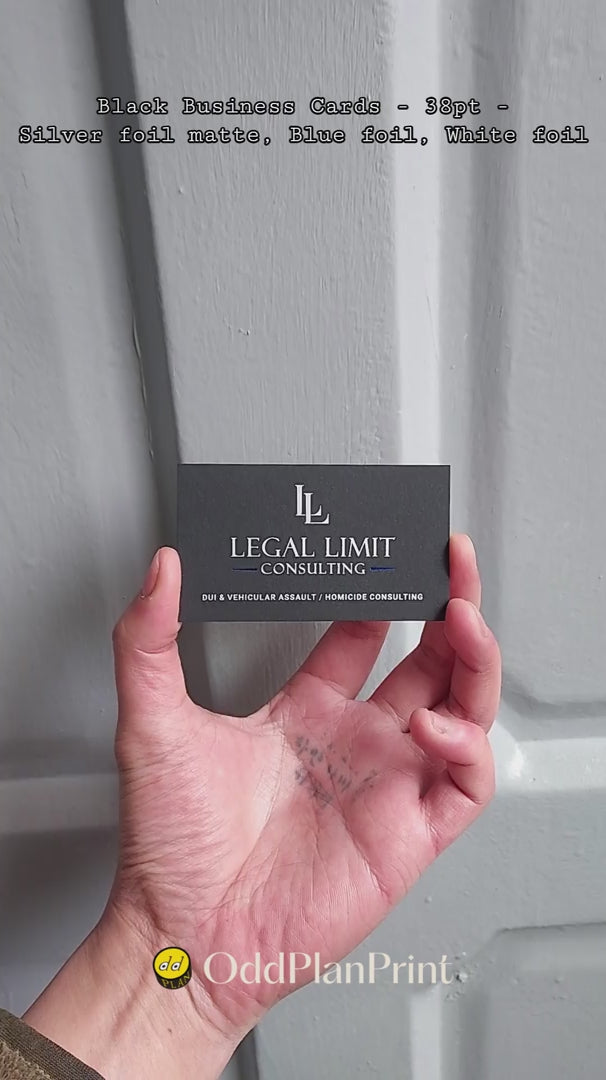Contrasting 38pt black business card by OddPlanPrint, featuring silver matte, blue glossy, and white foil.