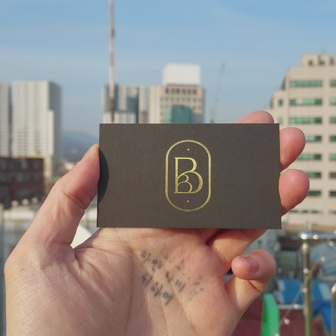 Elegant handcrafted black card with bold gold edge painting.