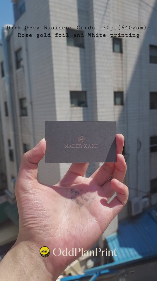 Luxury dark grey business cards featuring rose gold foil stamping and crisp white printing in 540gsm by OddPlanPrint.