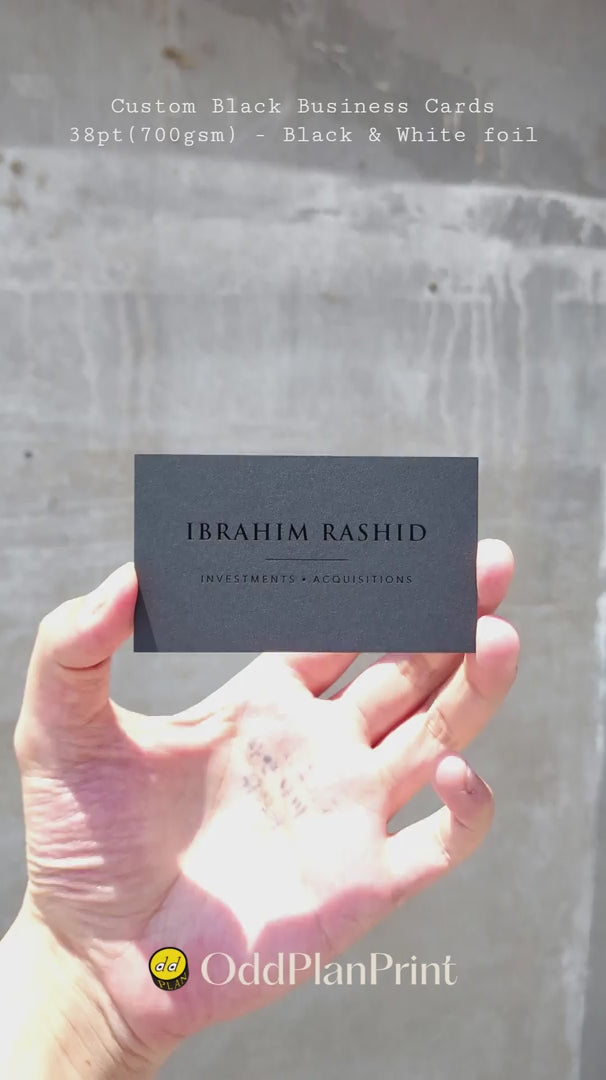 Premium custom black business cards 38pt thick with glossy black foil and white foil finishing from OddPlanPrint.