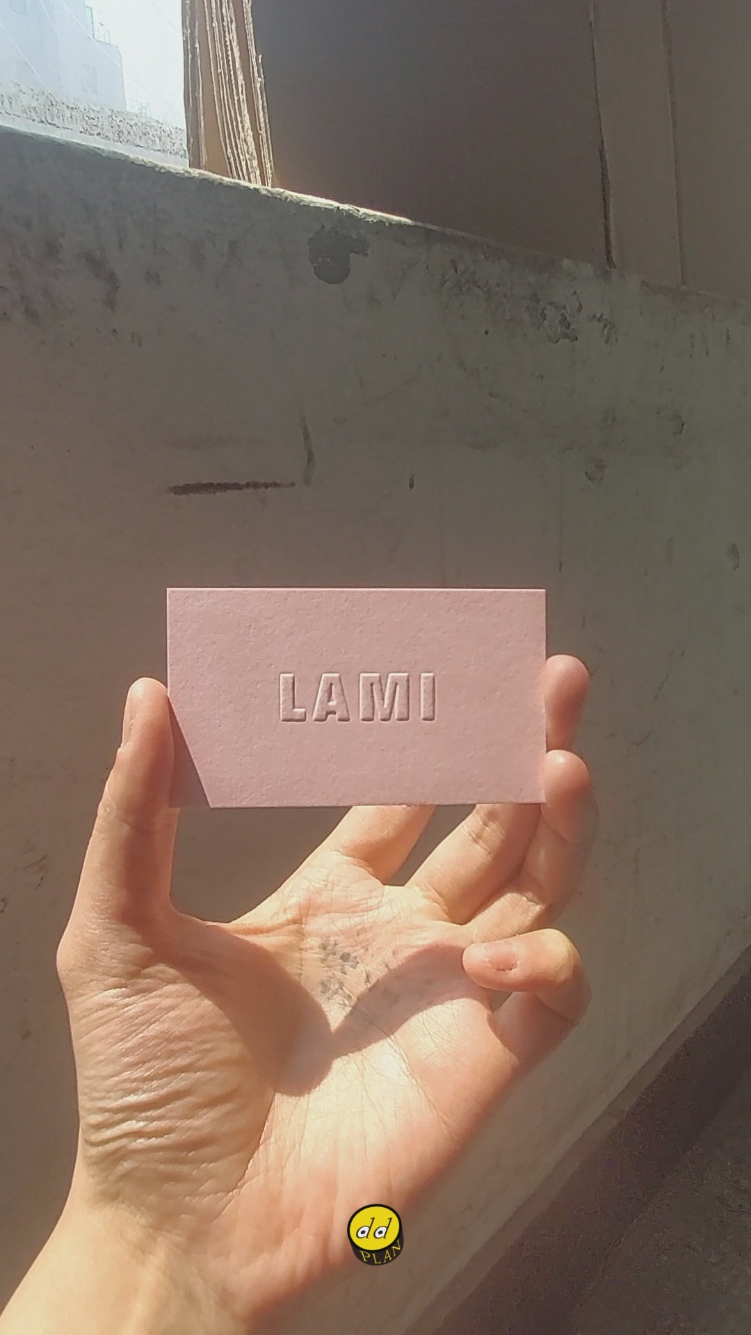 Elegant embossed pink card with high-quality finish.