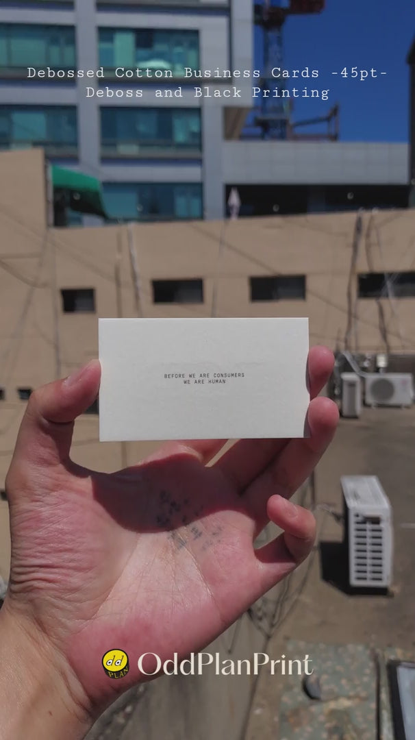 Elegant debossed cotton business cards on 45pt stock with deboss and black printing made by OddPlanPrint.