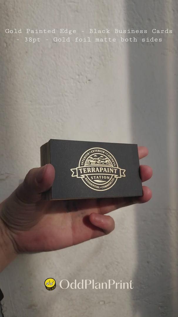 Thick 38pt black business cards featuring matte gold foil and gold painted edges by OddPlanPrint.