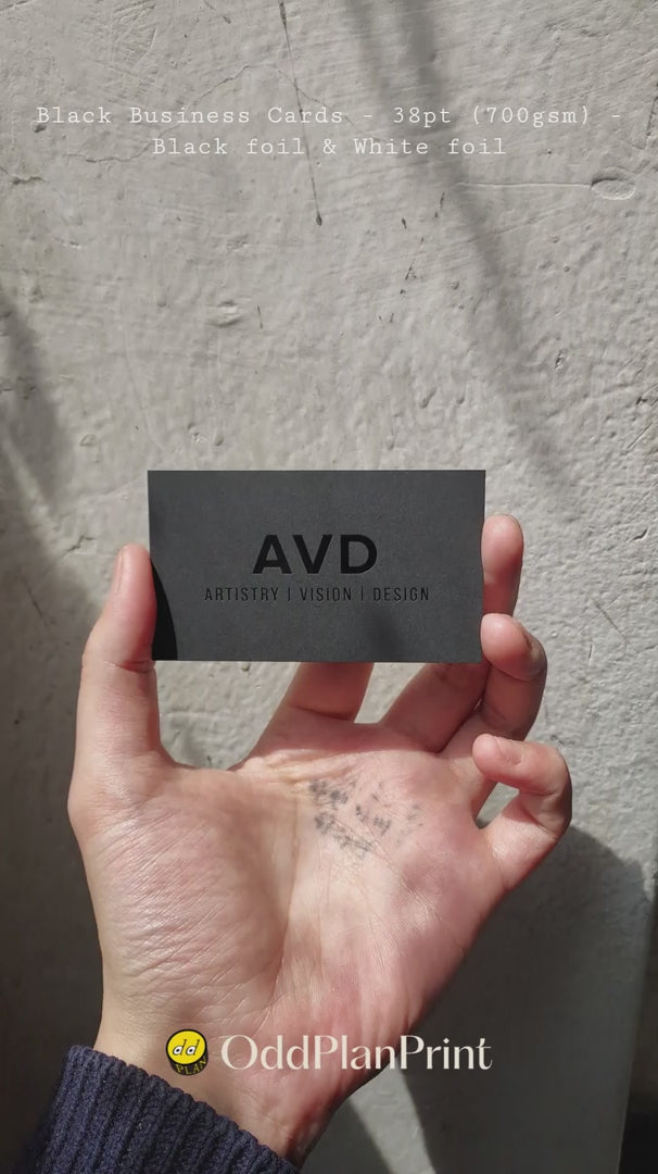 Elegant black business cards with glossy black foil and white foil on 38pt thick stock. made by OddPlanPrint.
