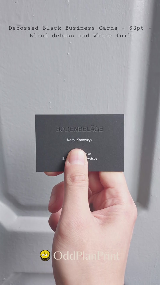 OddPlanPrint's 38pt black business card. Features a blind deboss for a unique tactile experience and white foil for elegant branding.