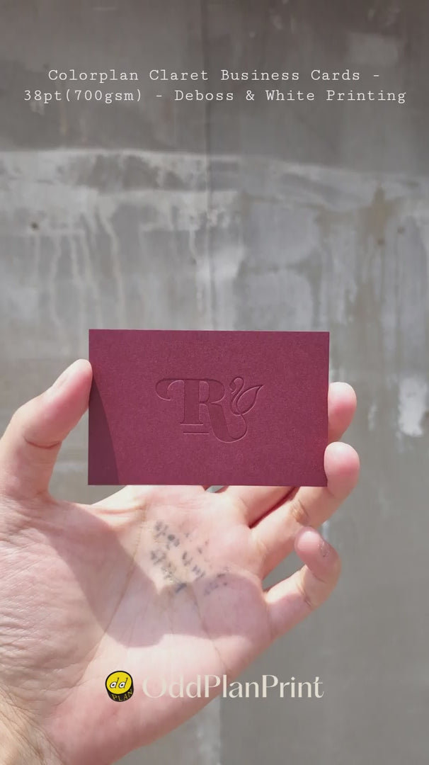 Premium Colorplan Claret business cards on heavy 38pt stock combining blind deboss with sharp white printing by OddPlanPrint.