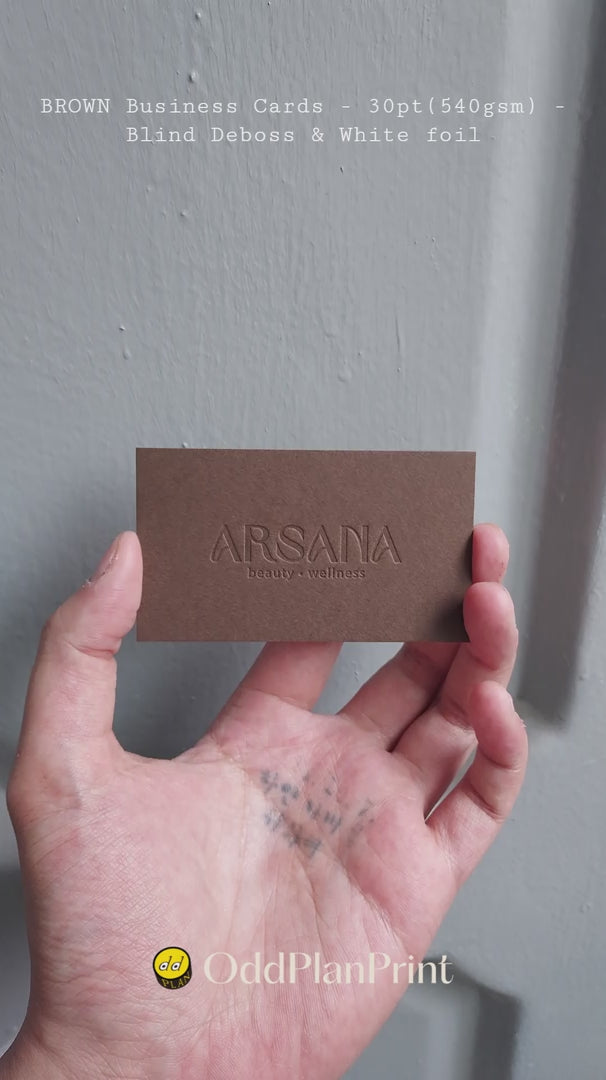 Refined brown debossed business cards on heavy 30pt(540gsm) stock with white foil shine made by OddPlanPrint.