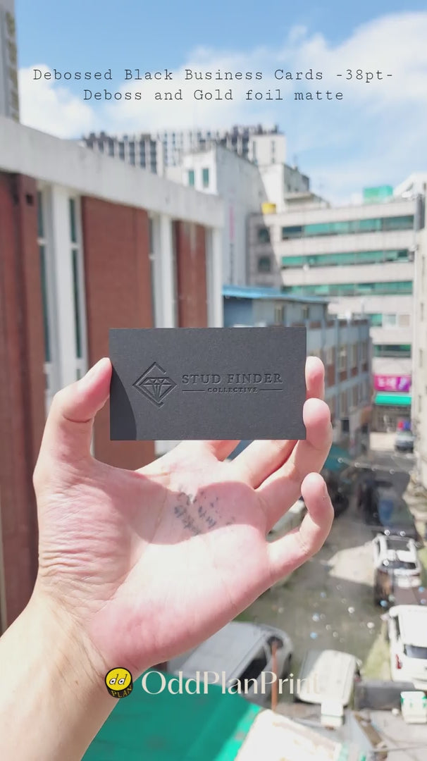Premium black business cards 38pt thick debossed with matte gold foil by OddPlanPrint.