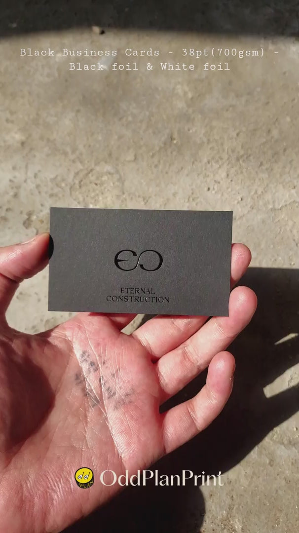 Luxury black business cards 38pt with glossy black foil and white foil contrast by OddPlanPrint.