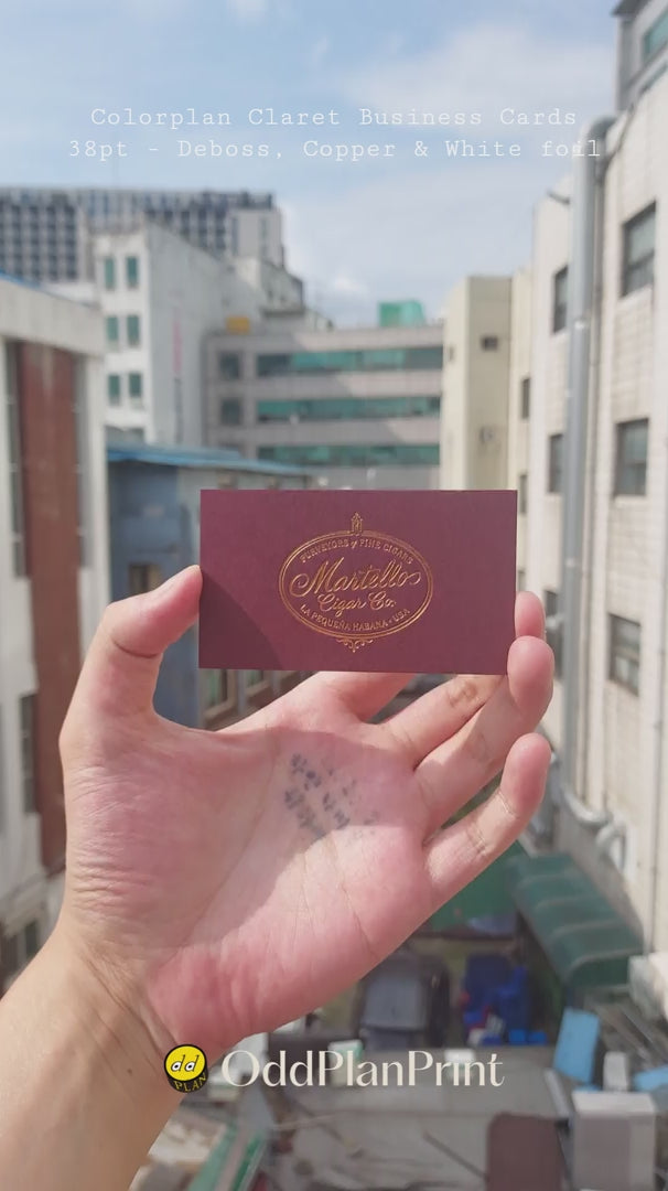 Thick Colorplan Claret 38pt business cards featuring copper and white foil with blind deboss from OddPlanPrint.