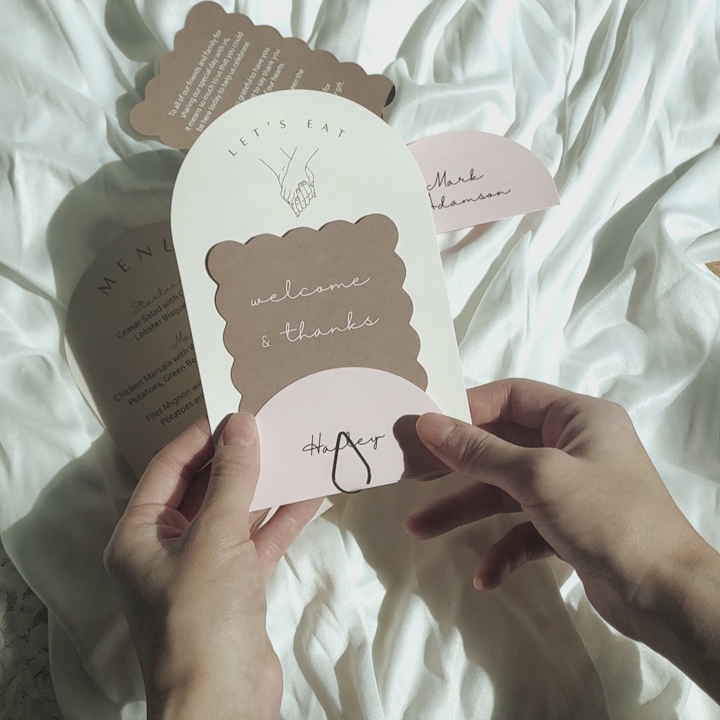 Custom 3-piece wedding stationery set with arch menu, ripple thank you, and semicircle place card—crafted on FSC paper, soy-ink printed, with optional gold or black clips.