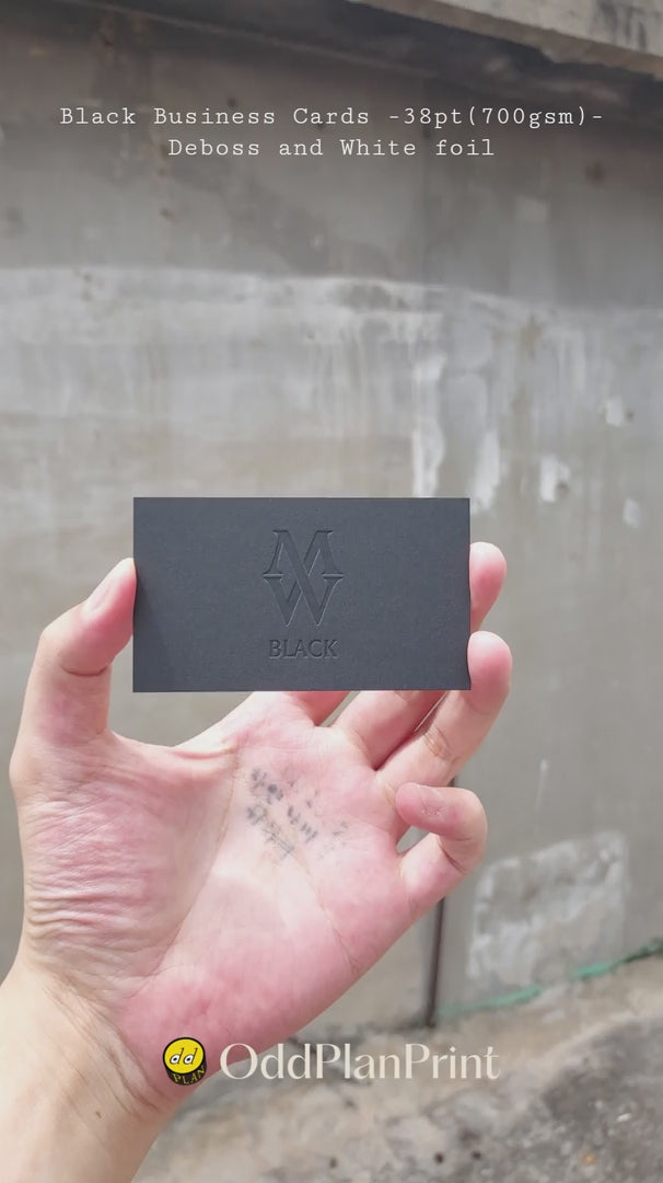 Black business cards 38pt thick with deboss and white foil details produced by OddPlanPrint.