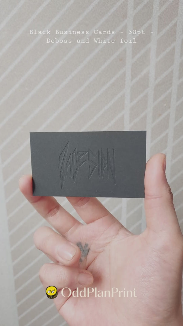 OddPlanPrint - 38pt black business card, a masterpiece of monochromatic design with a deep deboss and crisp white foil.