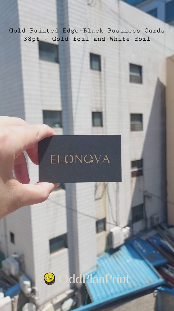 Premium black business cards with gold painted edges, gold foil and white foil on heavy 38pt stock. made by OddPlanPrint.