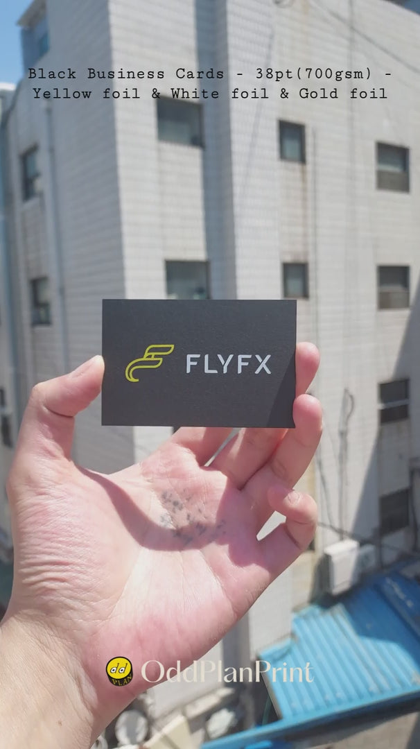 Premium black business cards with yellow foil, white foil and gold foil on heavy 38pt stock. made by OddPlanPrint.