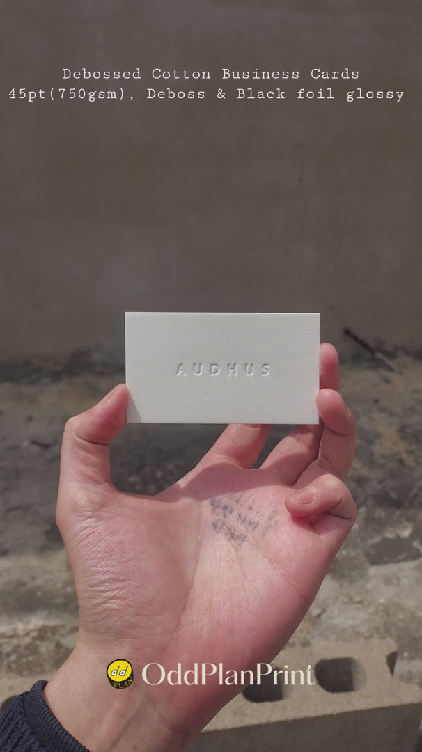 Debossed cotton business cards 45pt(750gsm) premium thick stationery by OddPlanPrint with glossy black foil.