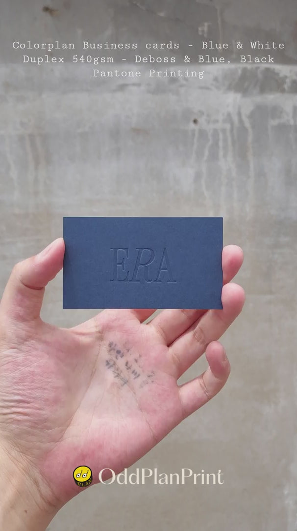 Luxury Colorplan duplex business cards 540gsm featuring blind deboss and blue black Pantone printing produced by OddPlanPrint.