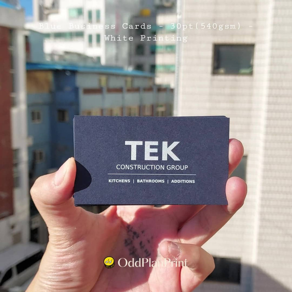 Blue business cards use crisp white printing for clear brand details on 30pt stock by OddPlanPrint.