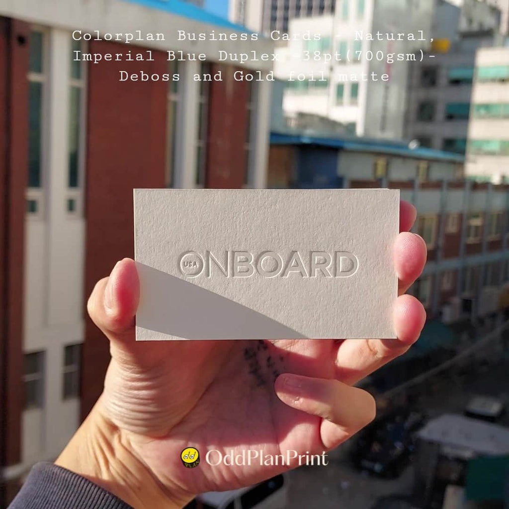 Material-led business cards use contrasting Colorplan stocks, debossing, and matte gold foil. by OddPlanPrint.