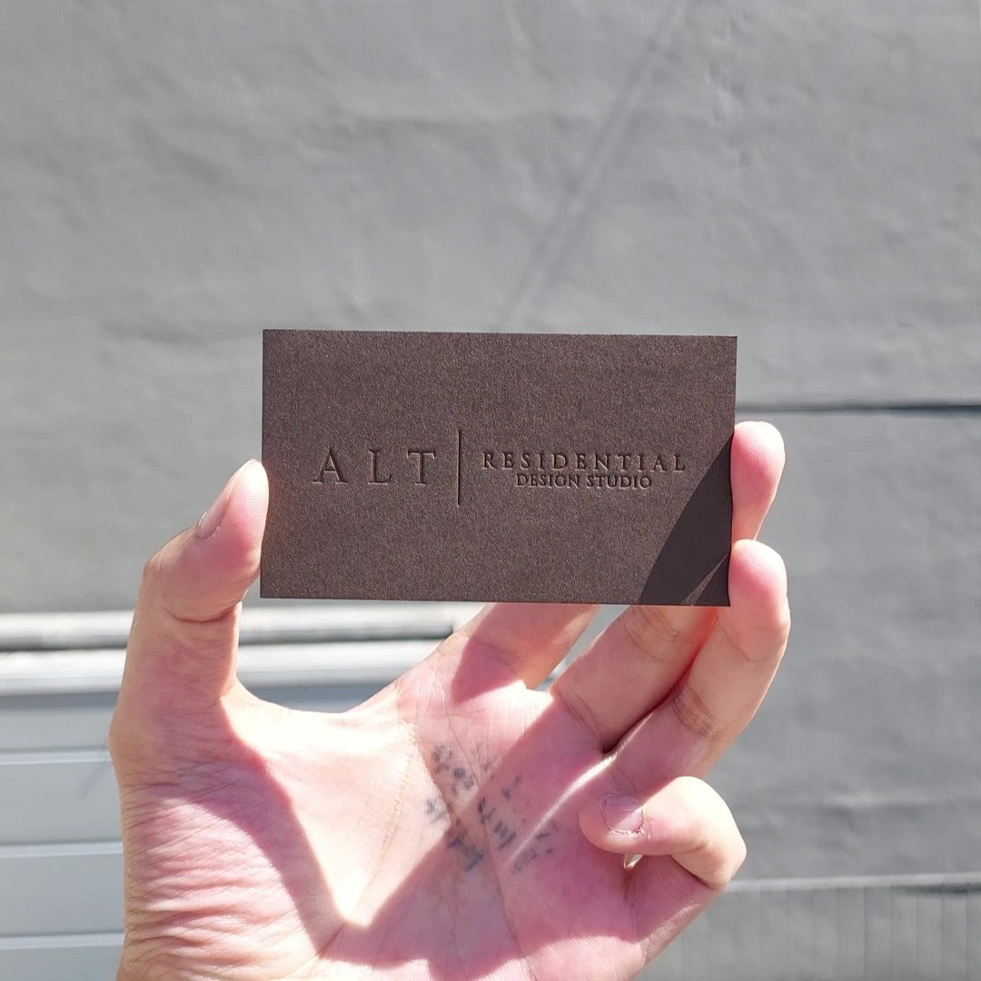 Heavy Bitter Chocolate Colorplan business cards featuring gold foil and deboss by OddPlanPrint.