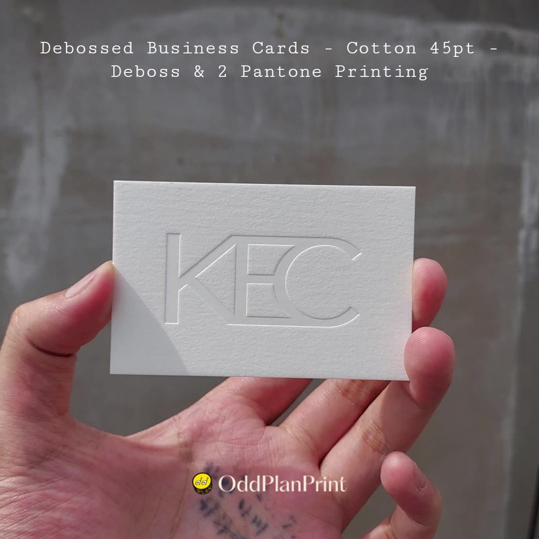 Two Pantone colors sharpen these cotton business cards while a deep deboss adds texture.